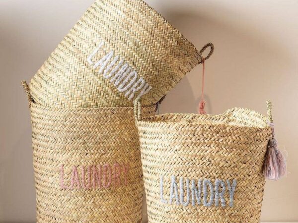 37f2dd4e4079c5cf6bd8ce761123ca5aebbf4fe98849320d2a0ce9a4208eea53-1.jpeg Title: Woven Palm Basket Laundry with Handles 🌸