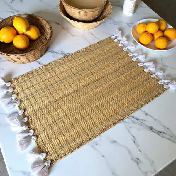 3992c8fb-8fee-4572-b46c-e1da5f1a6111.webp Hand-Woven Moroccan Tassel Placemats – Rattan & Cotton Dining Decor (15.5″ × 12″)