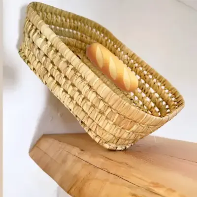 4108378aae43447ee4921f6ada3b106cd7cc5d31a7d6209e30773be721433af8-1.webp Handwoven Basketball Bread & Fruit Basket – Rustic Kitchen & Dining Decor