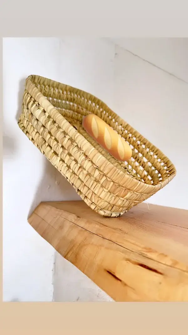 4108378aae43447ee4921f6ada3b106cd7cc5d31a7d6209e30773be721433af8-1.webp Handwoven Basketball Bread & Fruit Basket – Rustic Kitchen & Dining Decor