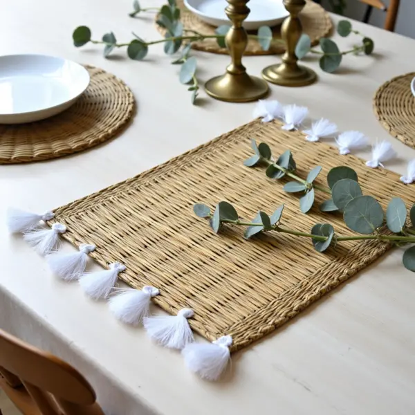 43a98565-1424-4a9f-806f-5626948f6e36.webp Hand-Woven Moroccan Tassel Placemats – Rattan & Cotton Dining Decor (15.5″ × 12″)