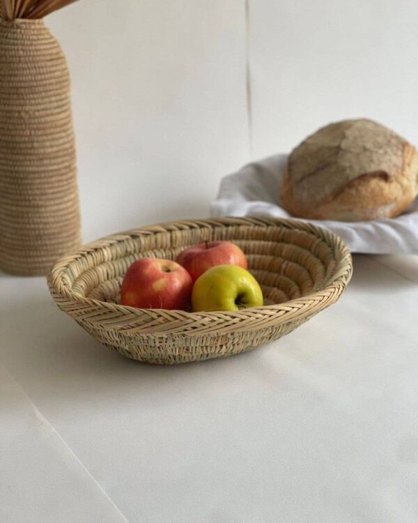 5fd1f9df358c0fd69f82fcb5a5e1bf292fb5b8d59d9d8b8150105cccd415870c-1.jpeg Handwoven Palm Leaf Basket – Fruit, Bread & Decorative Storage
