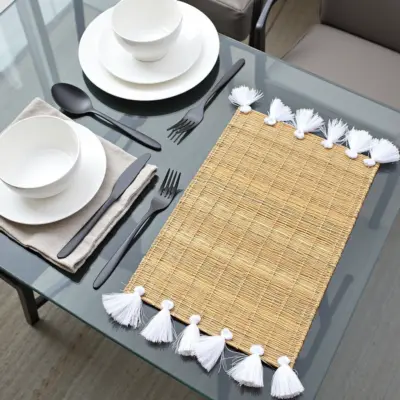 660c0851-41c6-4b25-8e00-088701d0d934.webp Hand-Woven Moroccan Tassel Placemats – Rattan & Cotton Dining Decor (15.5″ × 12″)