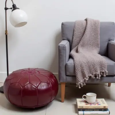 Deep-Red-Leather-Pouf-Round-5.webp Deep Red Moroccan Leather Pouf – Handcrafted Round Ottoman (21″ × 12″)