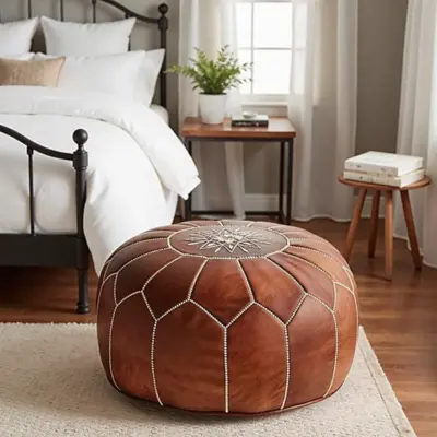 Handcrafted-Genuine-Tan-Leather-Pouf-Ottoman-2.webp Handcrafted Tan Leather Pouf – Moroccan Ottoman with Snowflake Embroidery (21″ × 12″)
