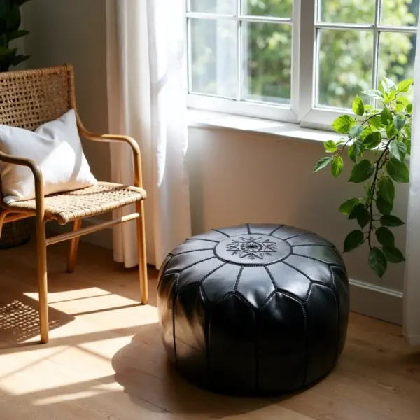 Handcrafted-Moroccan-Leather-Pouf-Black-in-Black-3.webp Black Moroccan Leather Pouf – Handcrafted Round Ottoman with Tone-on-Tone Stitching (21″ × 12″)