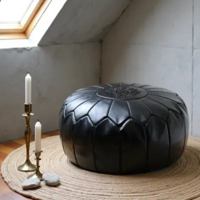 Handcrafted-Moroccan-Leather-Pouf-Black-in-Black-4.webp Black Moroccan Leather Pouf – Handcrafted Round Ottoman with Tone-on-Tone Stitching (21″ × 12″)