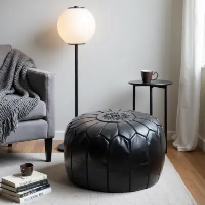 Handcrafted-Moroccan-Leather-Pouf-Black-in-Black-5.webp Black Moroccan Leather Pouf – Handcrafted Round Ottoman with Tone-on-Tone Stitching (21″ × 12″)