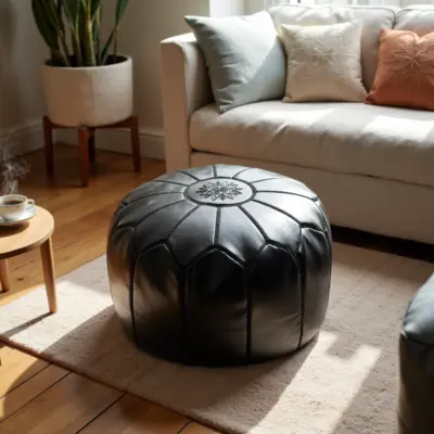 Handcrafted-Moroccan-Leather-Pouf-Black-in-Black-8.webp Black Moroccan Leather Pouf – Handcrafted Round Ottoman with Tone-on-Tone Stitching (21″ × 12″)