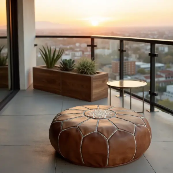 Handmade-Moroccan-Leather-Pouf-Natural-Tan-1.webp Natural Leather Moroccan Pouf – Handcrafted Round Ottoman (21″ × 12″)