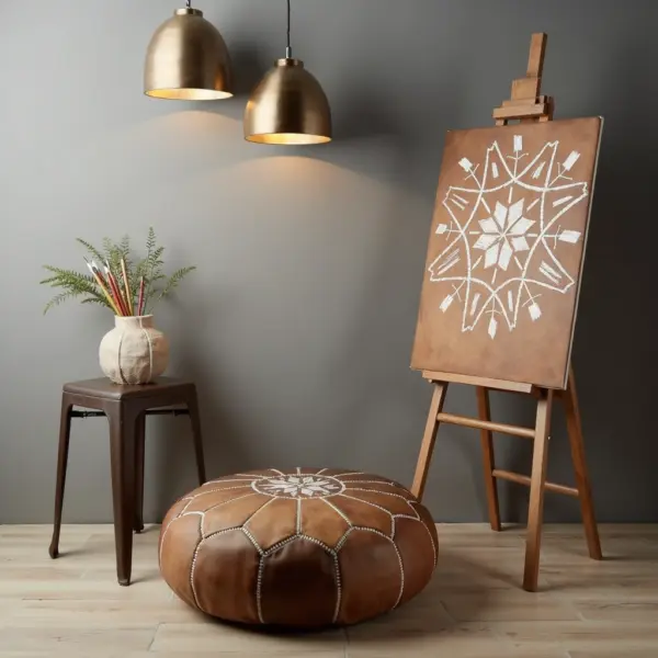 Handmade-Moroccan-Leather-Pouf-Natural-Tan-2.webp Natural Leather Moroccan Pouf – Handcrafted Round Ottoman (21″ × 12″)