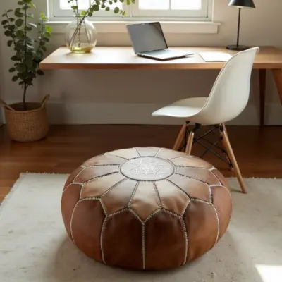Handmade-Moroccan-Leather-Pouf-Natural-Tan-3.webp Natural Leather Moroccan Pouf – Handcrafted Round Ottoman (21″ × 12″)