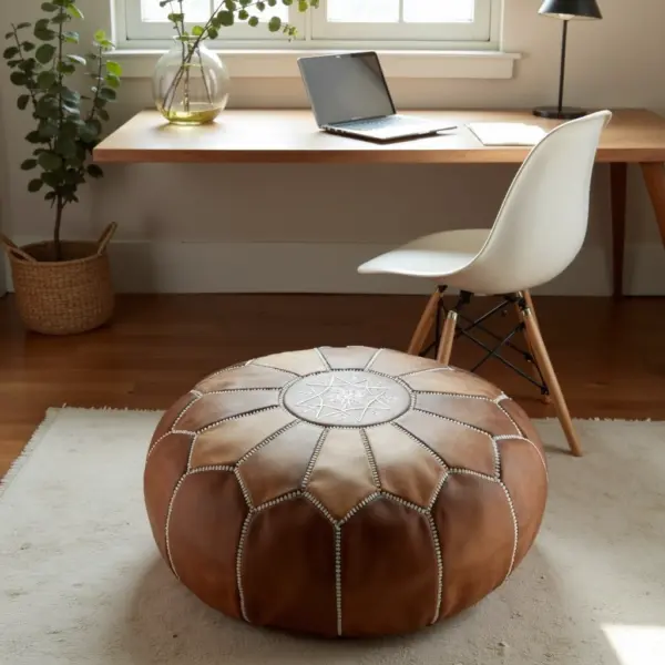 Handmade-Moroccan-Leather-Pouf-Natural-Tan-3.webp Natural Leather Moroccan Pouf – Handcrafted Round Ottoman (21″ × 12″)