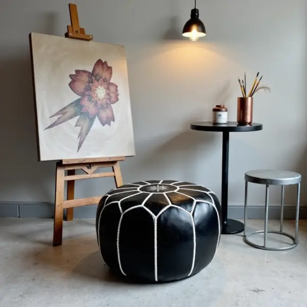 Round-Black-Moroccan-Leather-Pouf-with-White-Stitch-4.webp Black Moroccan Leather Pouf – Handcrafted Round Ottoman with White Stitching (21″ × 12″)