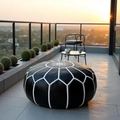Round-Black-Moroccan-Leather-Pouf-with-White-Stitch-7.webp Black Moroccan Leather Pouf – Handcrafted Round Ottoman with White Stitching (21″ × 12″)