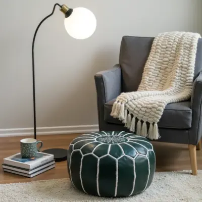 Round-Moroccan-Leather-Pouf-Green-1-1000x1000-1-1.webp Handcrafted Green Leather Pouf – 21″ Moroccan Round Ottoman with White Stitching
