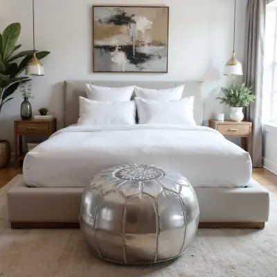 Round-Moroccan-Leather-Pouf-Silver-3.webp Silver Leather Pouf – Handcrafted Moroccan Ottoman (21″ × 12″) with White Stitching