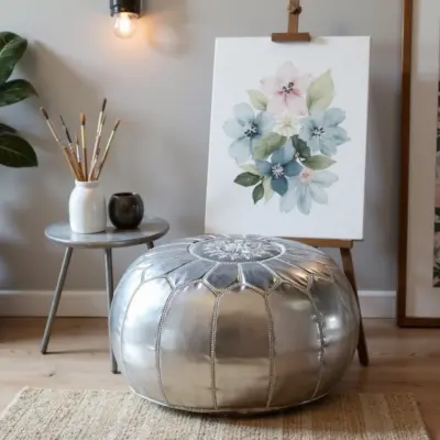 Round-Moroccan-Leather-Pouf-Silver-4.webp Silver Leather Pouf – Handcrafted Moroccan Ottoman (21″ × 12″) with White Stitching