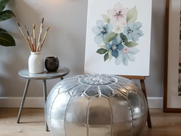 Round-Moroccan-Leather-Pouf-Silver-4.webp Silver Leather Pouf – Handcrafted Moroccan Ottoman (21″ × 12″) with White Stitching