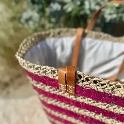 a8e5132fa18044457bc1607d1b42073a3b38d6ff52cbf026a284ae88c505ac2b-1.webp Sequin Basket – Handwoven Doum Palm Fiber Tote with Leather Handles & Drawstring Closure