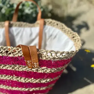 ac89b5d57a5a44f1aaab5dc9477303d2ba166145c7a4b6b9d840301ab45e9527-1.webp Sequin Basket – Handwoven Doum Palm Fiber Tote with Leather Handles & Drawstring Closure