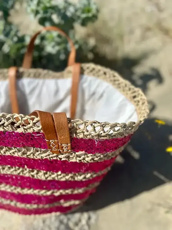 ac89b5d57a5a44f1aaab5dc9477303d2ba166145c7a4b6b9d840301ab45e9527-1.webp Sequin Basket – Handwoven Doum Palm Fiber Tote with Leather Handles & Drawstring Closure