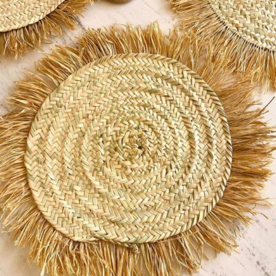 ae7d80d09318018f94e030c4a4b1d8fac030e7dc83bca44ce831ca09dc700922-1.jpeg Handwoven Wicker Moroccan Placemats with Tassels – Boho Table Decor