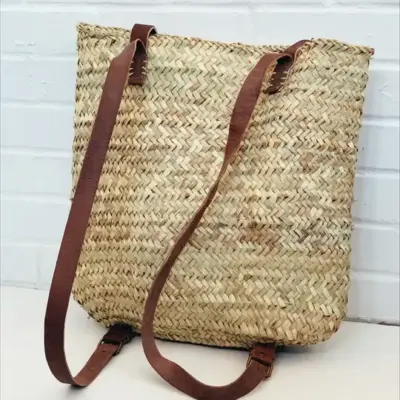 b75429adb8f31f40becfe8bb77ba55fae905ab2040d8dc249cfe533919f92f63-1.webp Wicker Picnic Basket – Handwoven Moroccan Basket for Outdoor Adventures & Storage