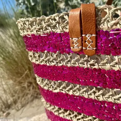 bc2139b863b08198e21b643d94259eccbc4a0d6d613be881fd51969f6fd0b527-1.webp Sequin Basket – Handwoven Doum Palm Fiber Tote with Leather Handles & Drawstring Closure