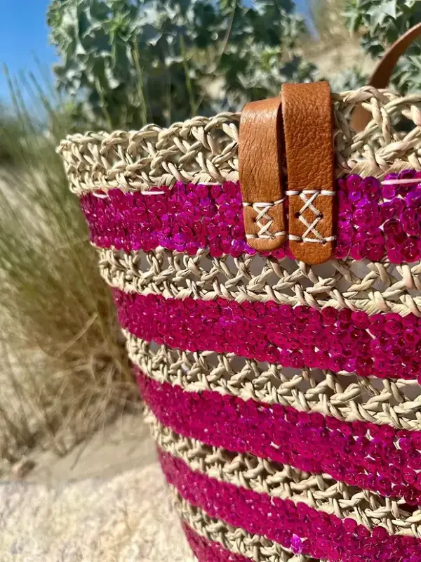 bc2139b863b08198e21b643d94259eccbc4a0d6d613be881fd51969f6fd0b527-1.webp Sequin Basket – Handwoven Doum Palm Fiber Tote with Leather Handles & Drawstring Closure