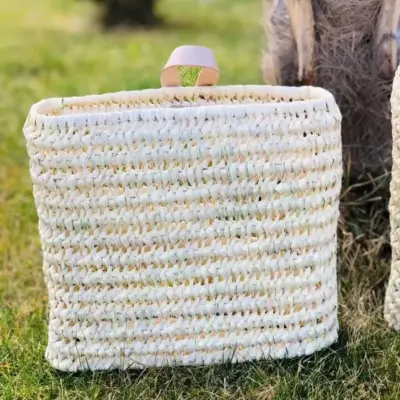 ca152c3b22fae3dd3eed51025fe7b88b605d9e3184bd65ea1f1e0ffcdb5eefa0-1.webp Duo of Palm Fiber & Leather Baskets | Handwoven Moroccan Wall Storage