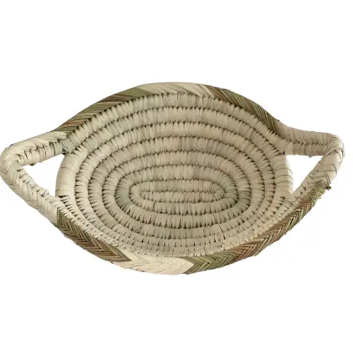 d2492baf21b2885f5415166845b17ab97bd60412333f547a3a8cdbc7a6099337-1.webp Handwoven Oval Basket – Natural Palm Leaf Storage & Serving Tray