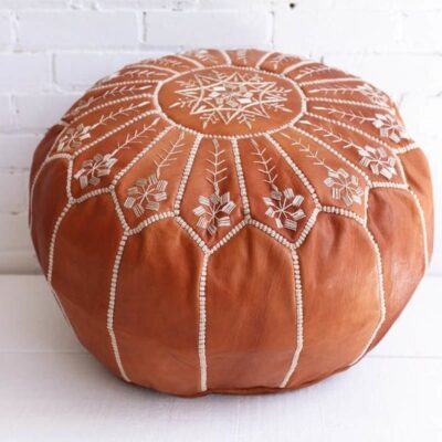 moroccan-leather-pouf-handmade-tan-deluze-800-600x900-1-1200x1200-1.jpg Handcrafted Tan Leather Pouf – Moroccan Ottoman with Snowflake Embroidery (21″ × 12″)